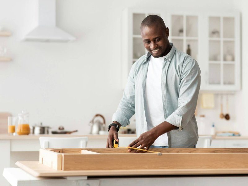 handyman-working-at-home-repairing-assembling-and-renovation-or-new-hobby-man-measuring-new-table-qlgt2rl6xig888cquouy6j6pdyjzrseopvc7o1kmeo